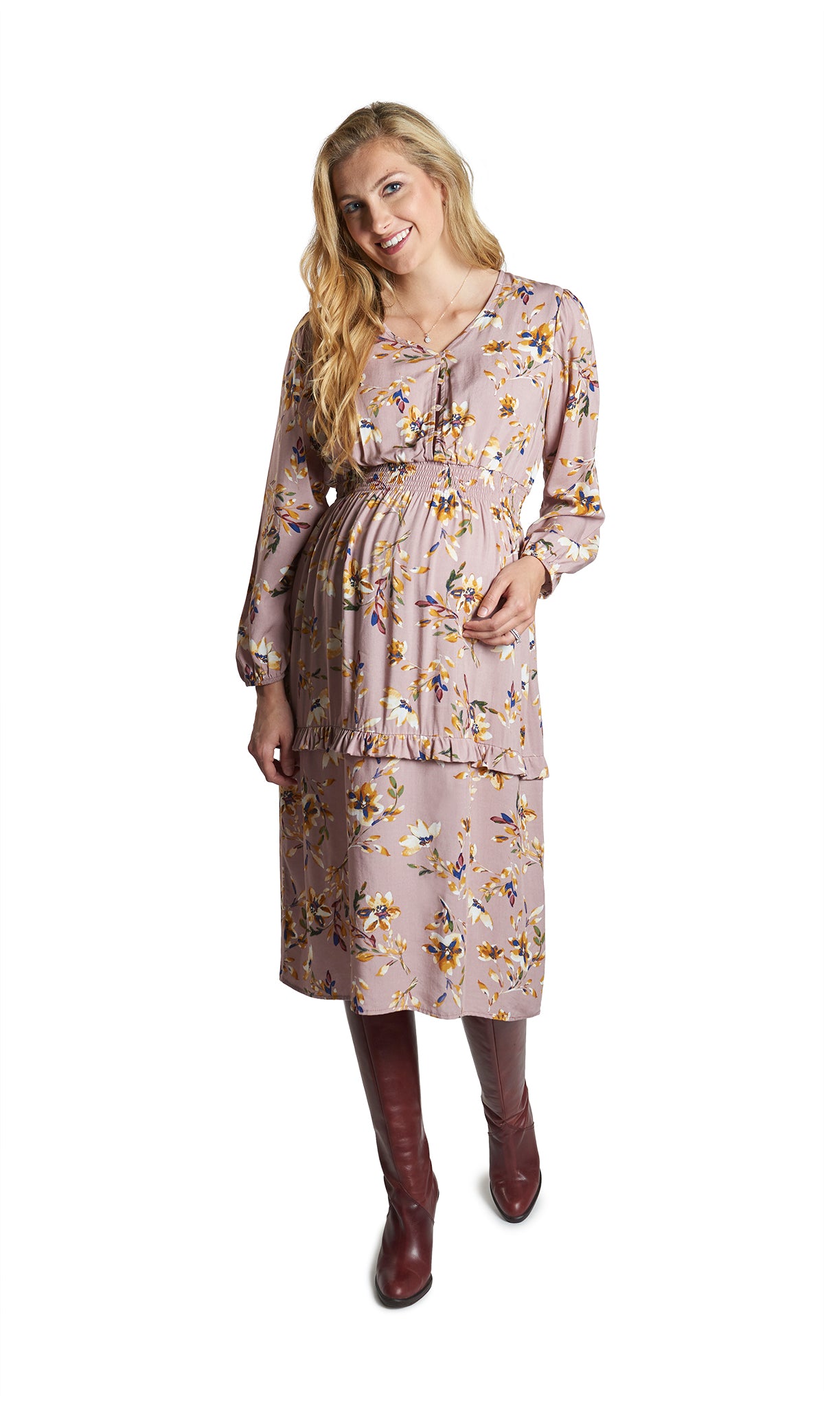 Mauve Floral Jenny Dress. Pregnant woman wearing Jenny dress and knee high burgundy boots.