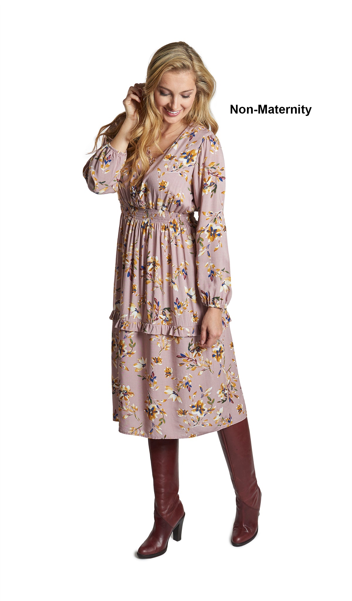 Mauve Floral Jenny Dress. Woman wearing Jenny dress as non-maternity with one hand touching the side of her face.