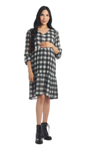 Ivory Black Plaid Tara dress worn by pregnant woman with one hand on her belly.