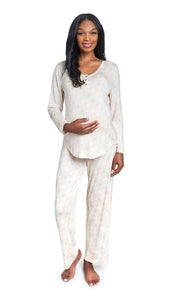 Mosaic Laina 2-Piece Set. Pregnant woman wearing button front placket long sleeve top and pant with one hand on belly.