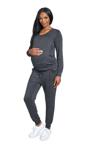 French Terry Charcoal Whitney 2-Piece on pregnant woman with one hand on her belly. Long sleeve top with nursing access and long pant with cuff hem.