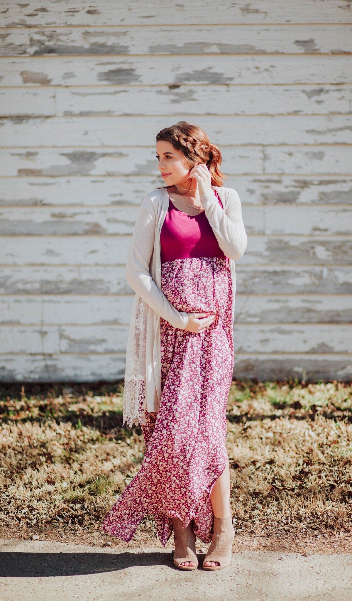 Poppy Maisie dress worn by pregnant woman with her hand on her belly.