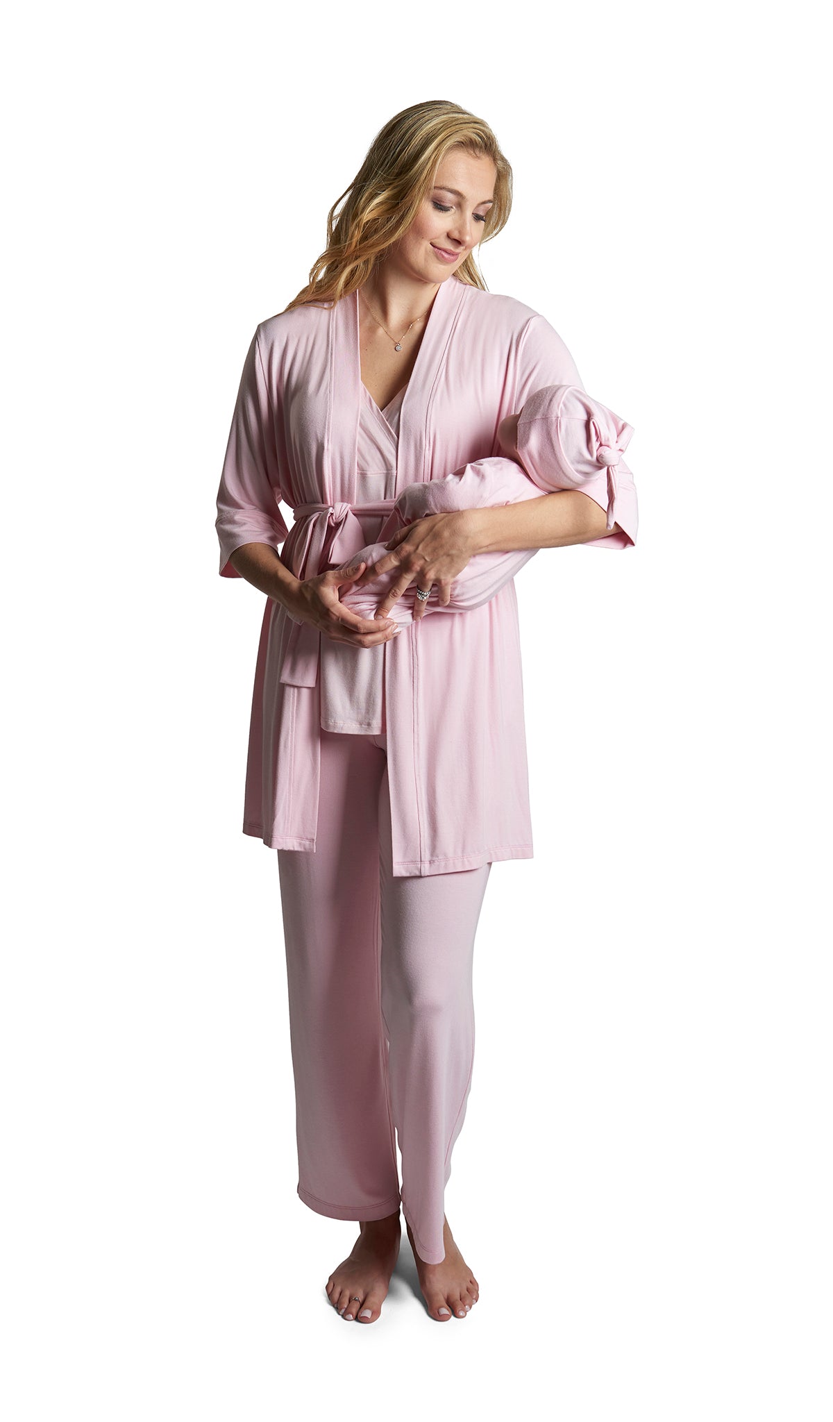 Blush Analise 5-Piece Set. Woman wearing 3/4 sleeve robe, tank top and pant while holding a baby wearing baby gown and knotted baby hat.