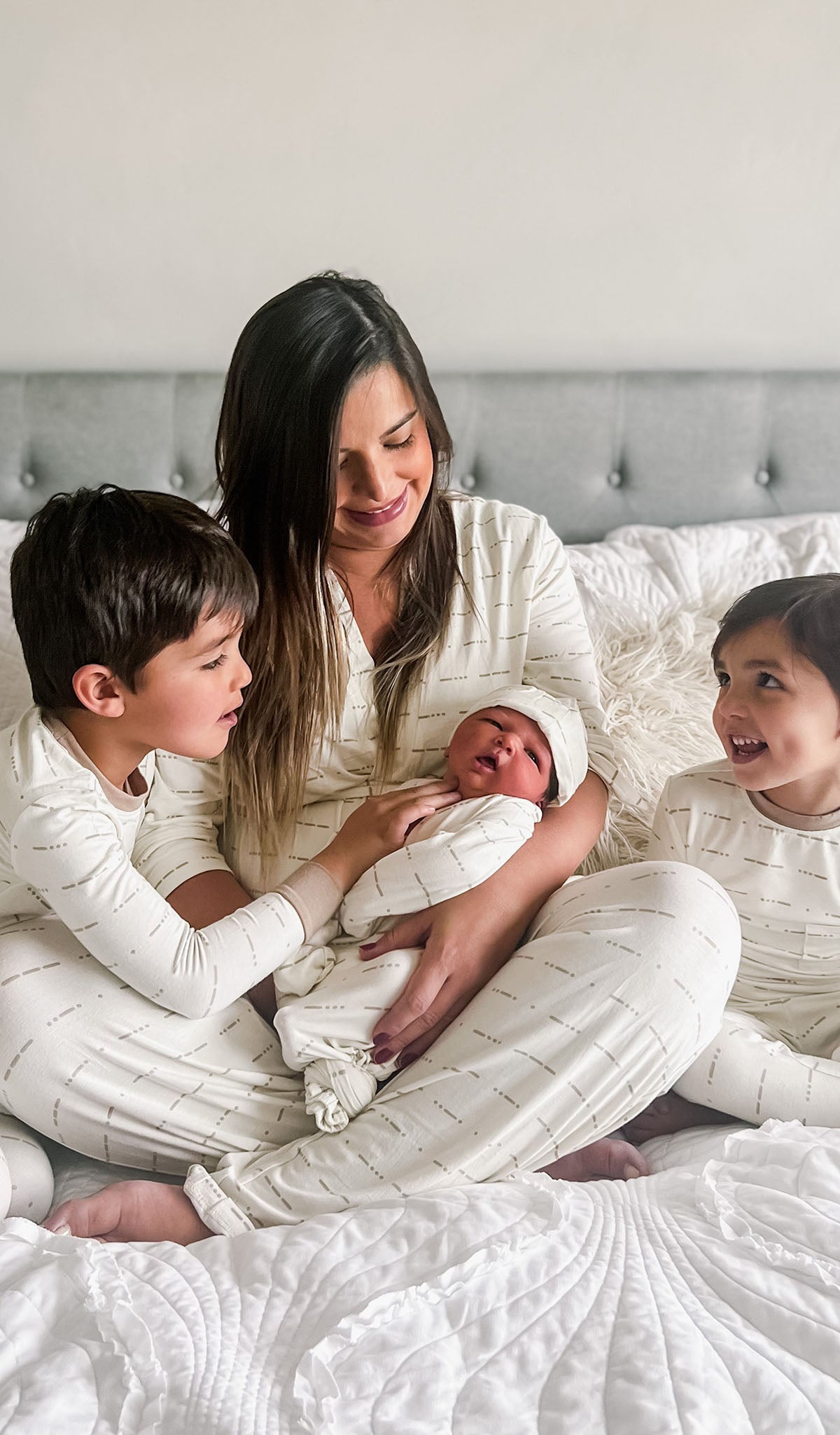 Love Analise 3-Piece Set worn by woman holding her newborn baby with two sons by her side.
