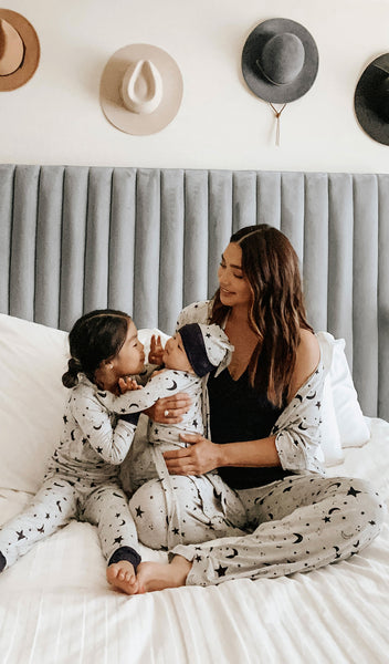 Twinkle Night Analise 5-Piece Set, woman wearing robe, tank top and pant while holding baby boy in matching baby gown with knotted hat and girl in matching Emerson pajama set.