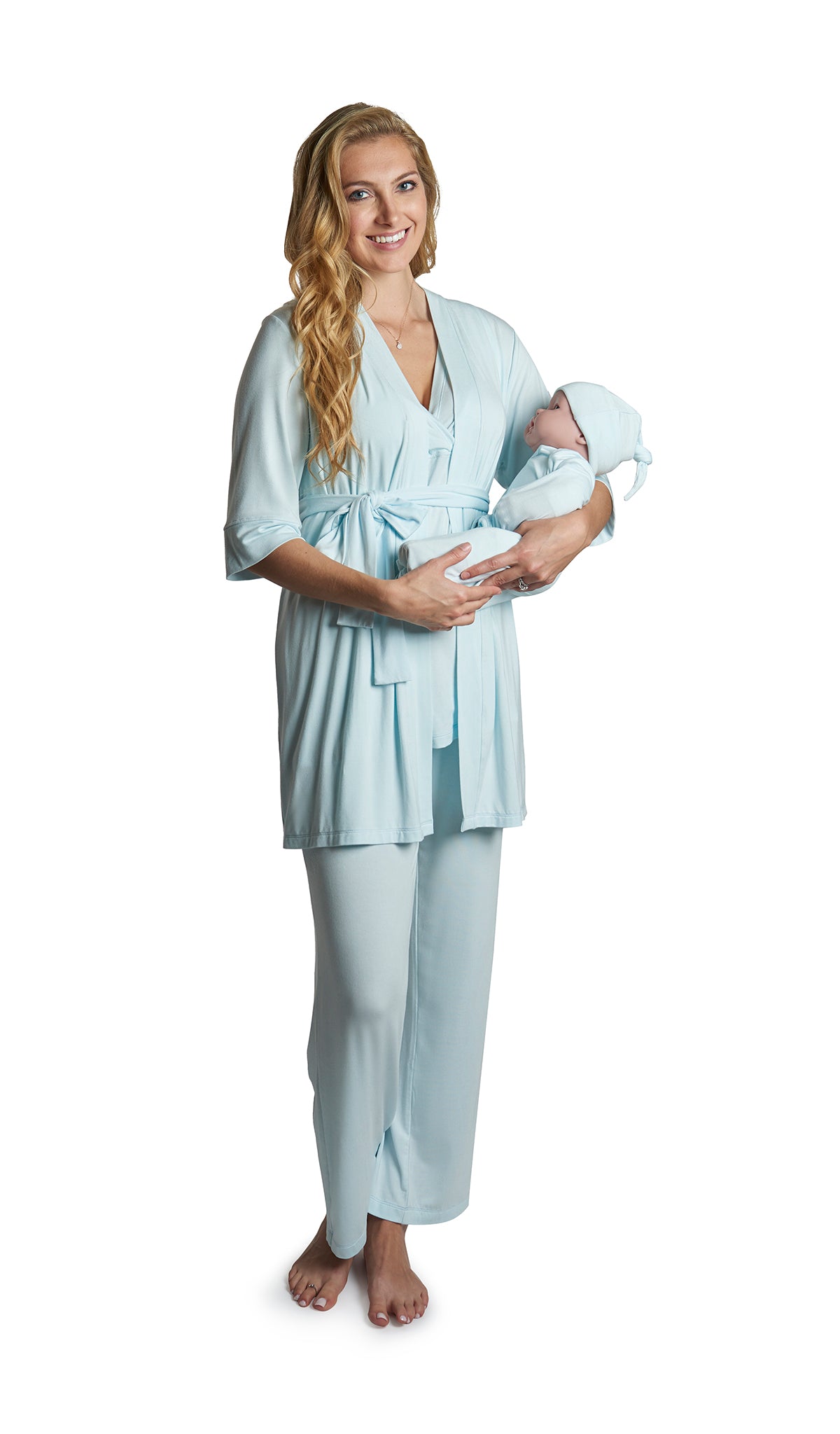 Whispering Blue Analise 5-Piece Set. Woman wearing 3/4 sleeve robe, tank top and pant while holding a baby wearing baby gown and knotted baby hat.