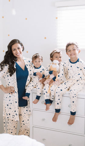 Twinkle Analise 3-Piece Set, woman standing wearing robe, tank top and pant next to 1 boy and 2 girls sitting together in matching Emerson pajama sets.