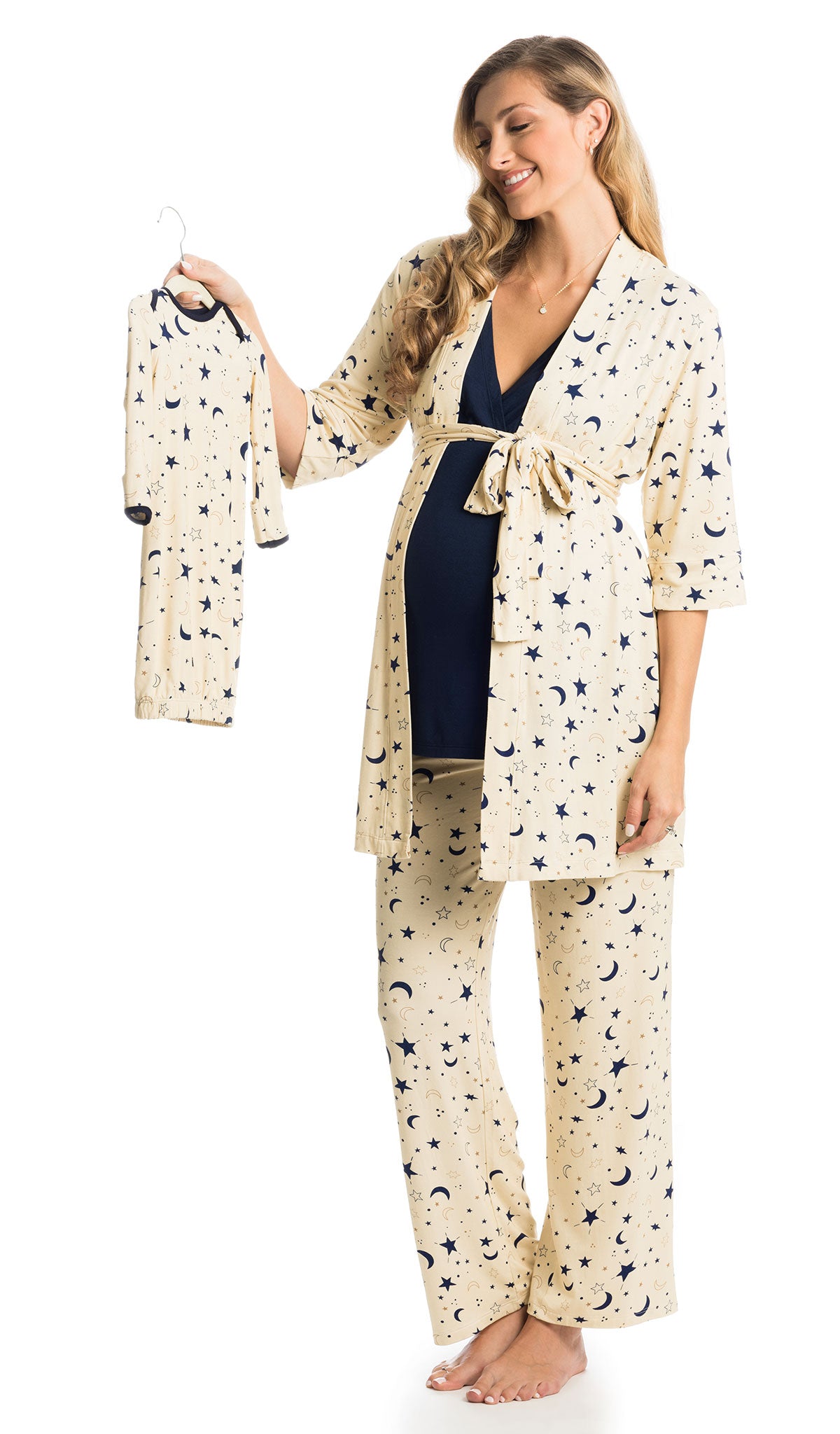 Twinkle Analise 5-Piece Set. Pregnant woman wearing 3/4 sleeve robe, tank top and pant while holding a baby gown.