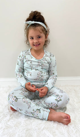Baby's Breath Charlie Baby 3-Piece Pant PJ worn by little girl sitting with her legs crossed.