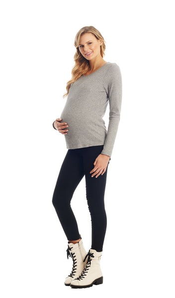 Grey Cristiano full length shot of top worn by pregnant woman with one hand on her belly.