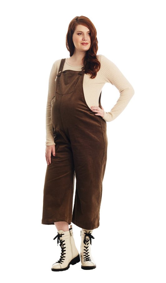 Olive Carlita overall worn by pregnant woman with one hand on her hip.