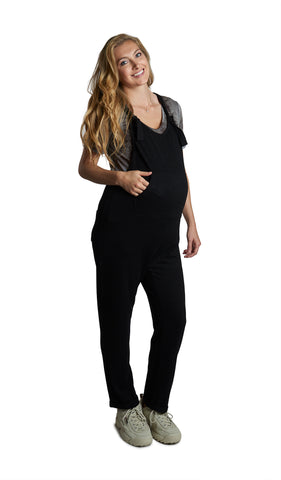 French Terry Black Natalie Overall. Pregnant woman wearing short sleeve tee shirt under Natalie overall with one hand in front kangaroo pocket.