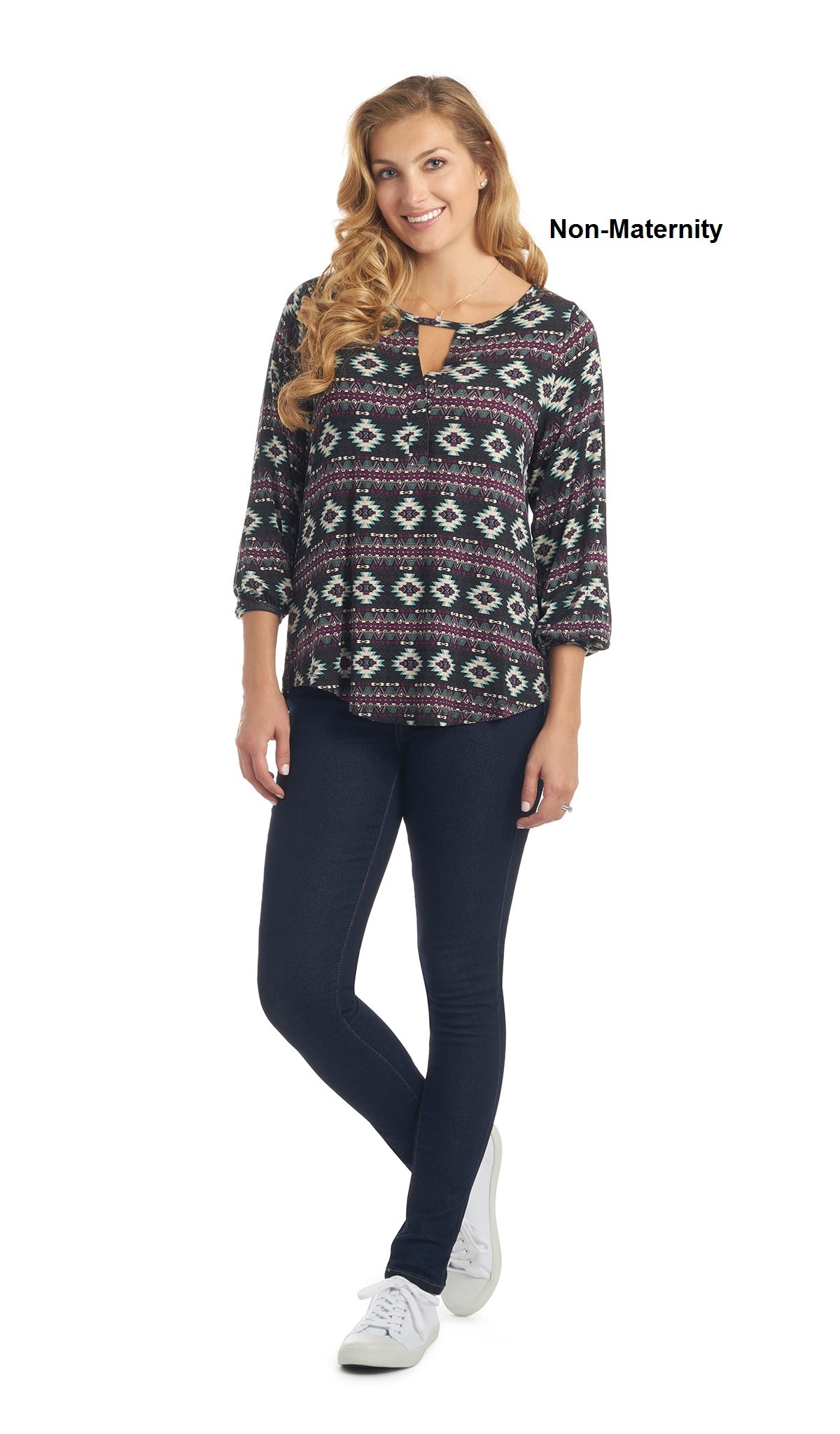 Aztec Purple Lila top worn by woman as non-maternity style with dark denim jeans..