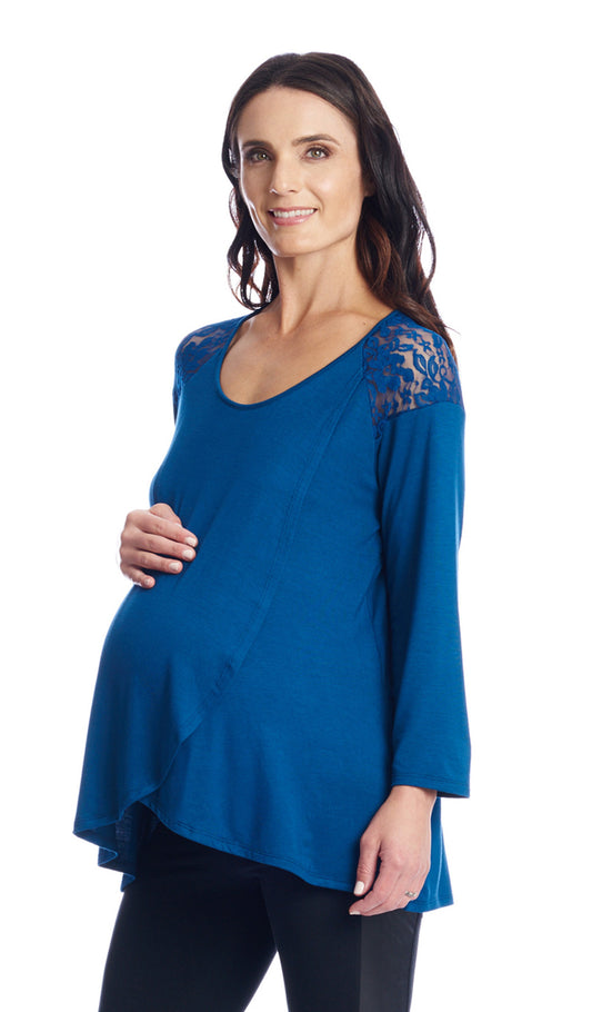 Teal Aaliyah top worn by pregnant woman with one hand on her belly.