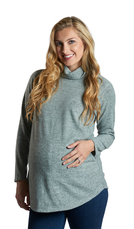 Dusty Sage Teresa Sweater. Pregnant woman wearing Teresa Sweater with one hand on her belly.