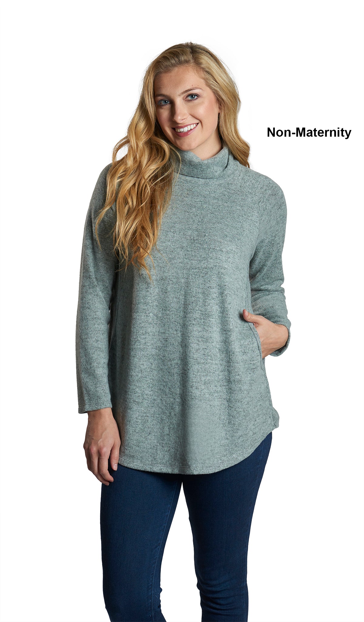 Dusty Sage Teresa Sweater. Woman wearing Teresa Sweater as non-maternity with one hand inside nursing pocket opening.