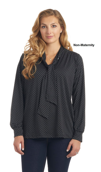 Black Dot Vanessa top worn by woman as non-maternity style with arms down to side.