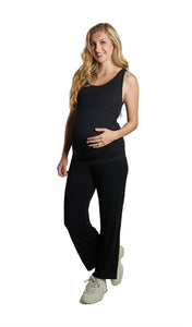Black Kara/Pirlo 2-Piece.  Full length shot of pregnant woman wearing Kara tank top and matching Pirlo pant with one hand on her belly.