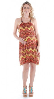 Aloha Kalani spaghetti strap knit jersey dress worn by pregnant woman with one hand on her belly.